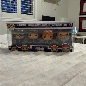 Funko 4-Pack Harry Potter Figures with Orange Hair and Yellow Faces